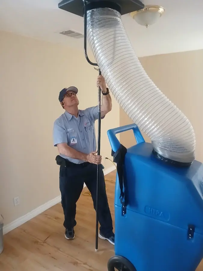 Furnace Tune-Up technician using HEPA equipment in Cypress Gardens